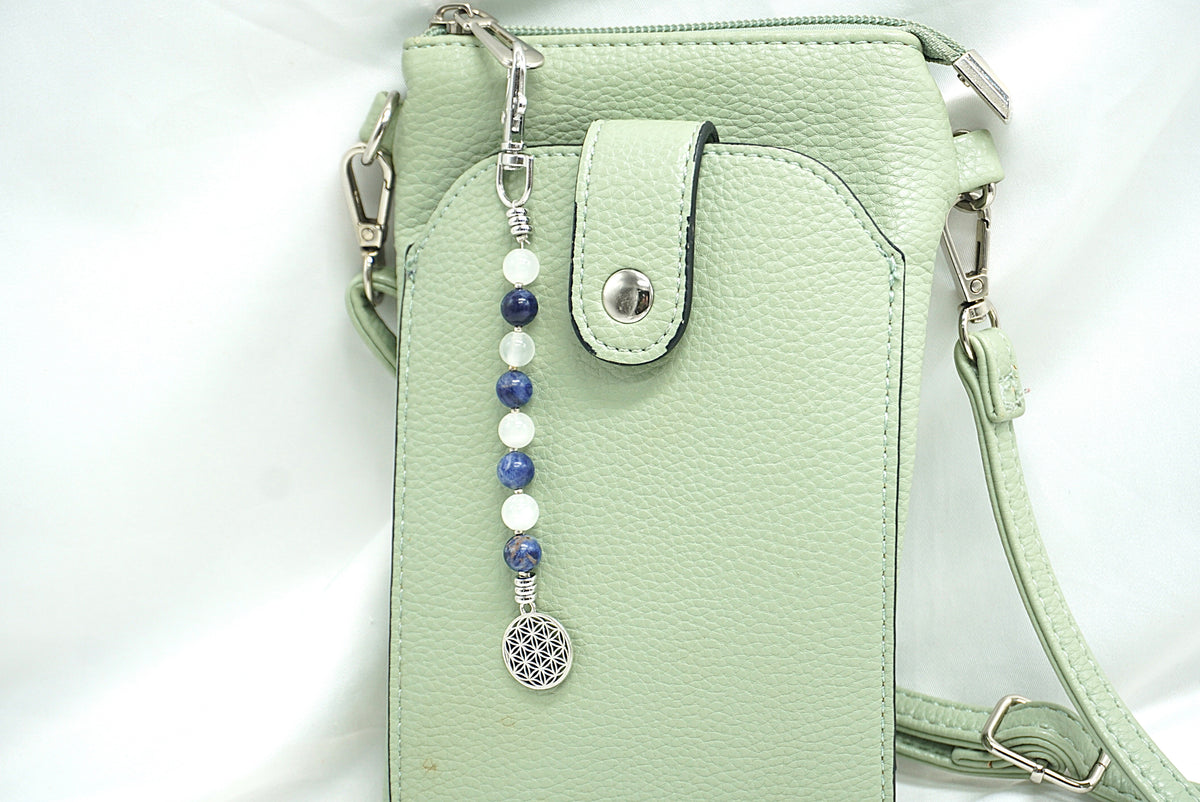 BIJOU DE SAC EN PERLES FLEUR DE VIE