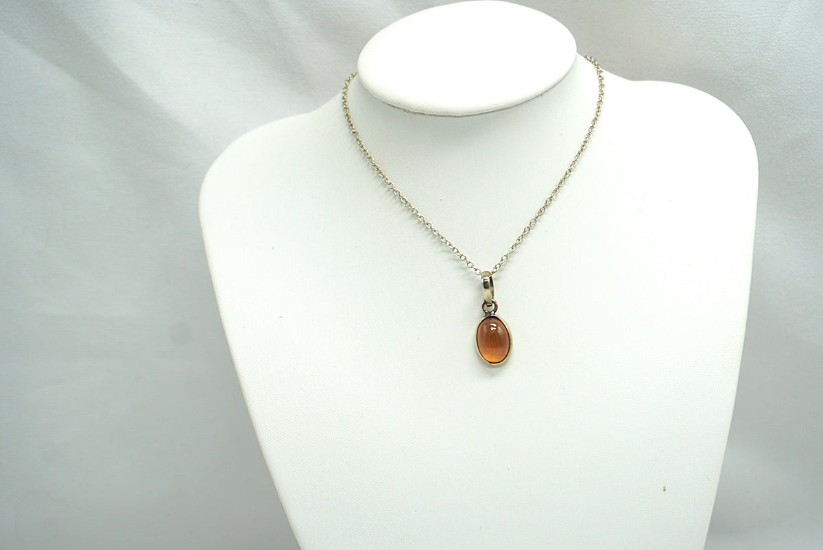 PENDENTIF GRENAT HESSONITE CERCLÉ